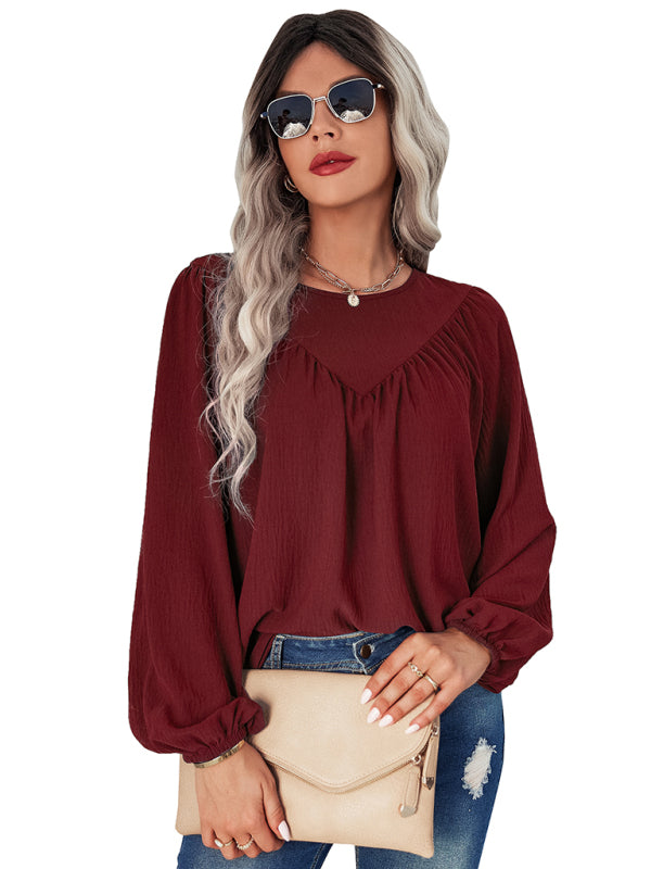 Camisa feminina casual solta com gola redonda e cor sólida